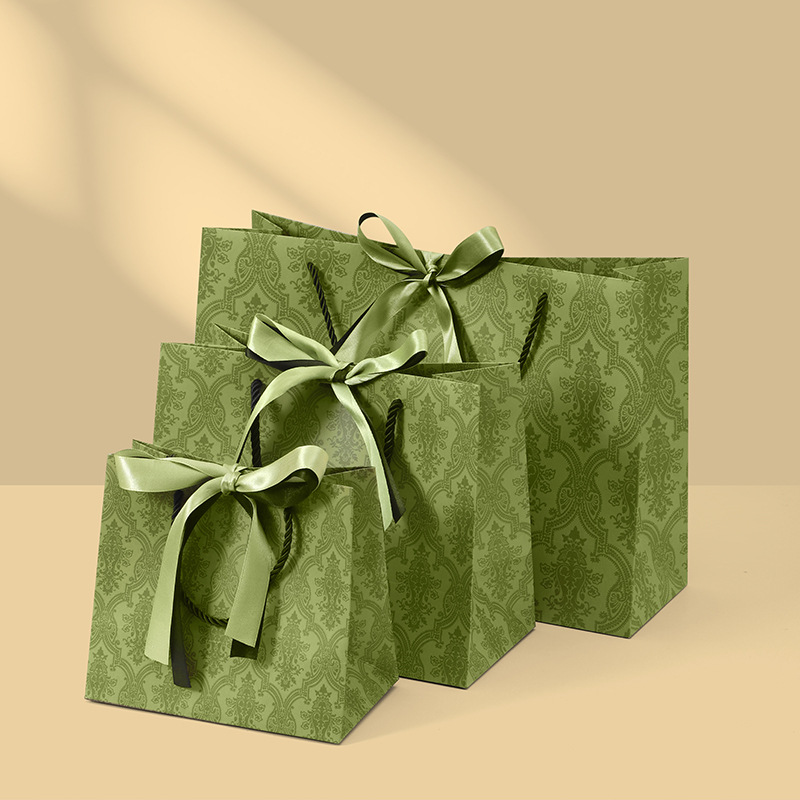 Coordinated paper gift bags in multiple sizes
